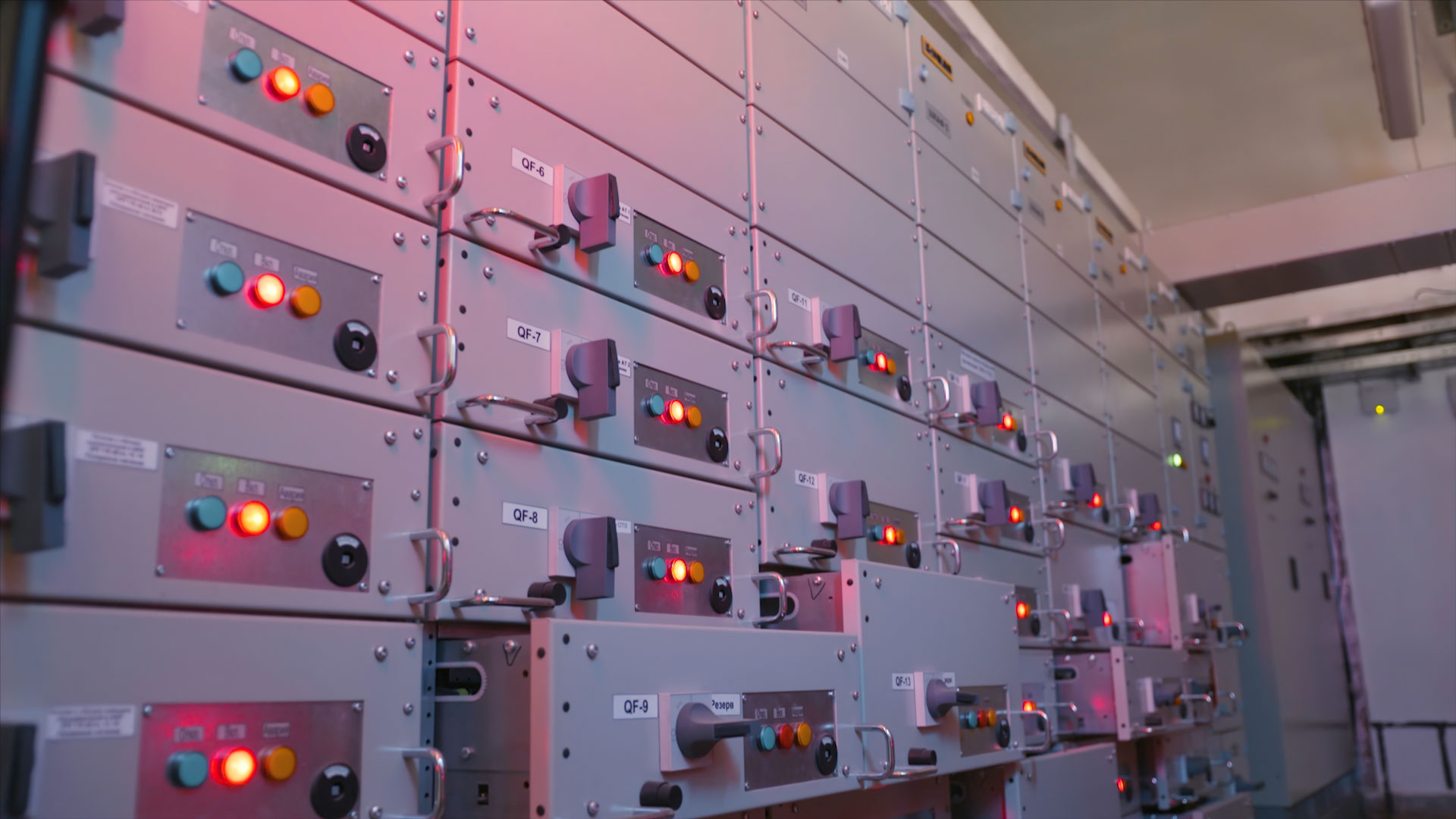 Electric control station shield. Action. Industrial electrical equipment with multiple control cells. Many buttons light up on control panels in electrical industry.